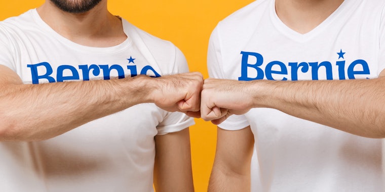 guys in Bernie Sanders shirts fist bumping