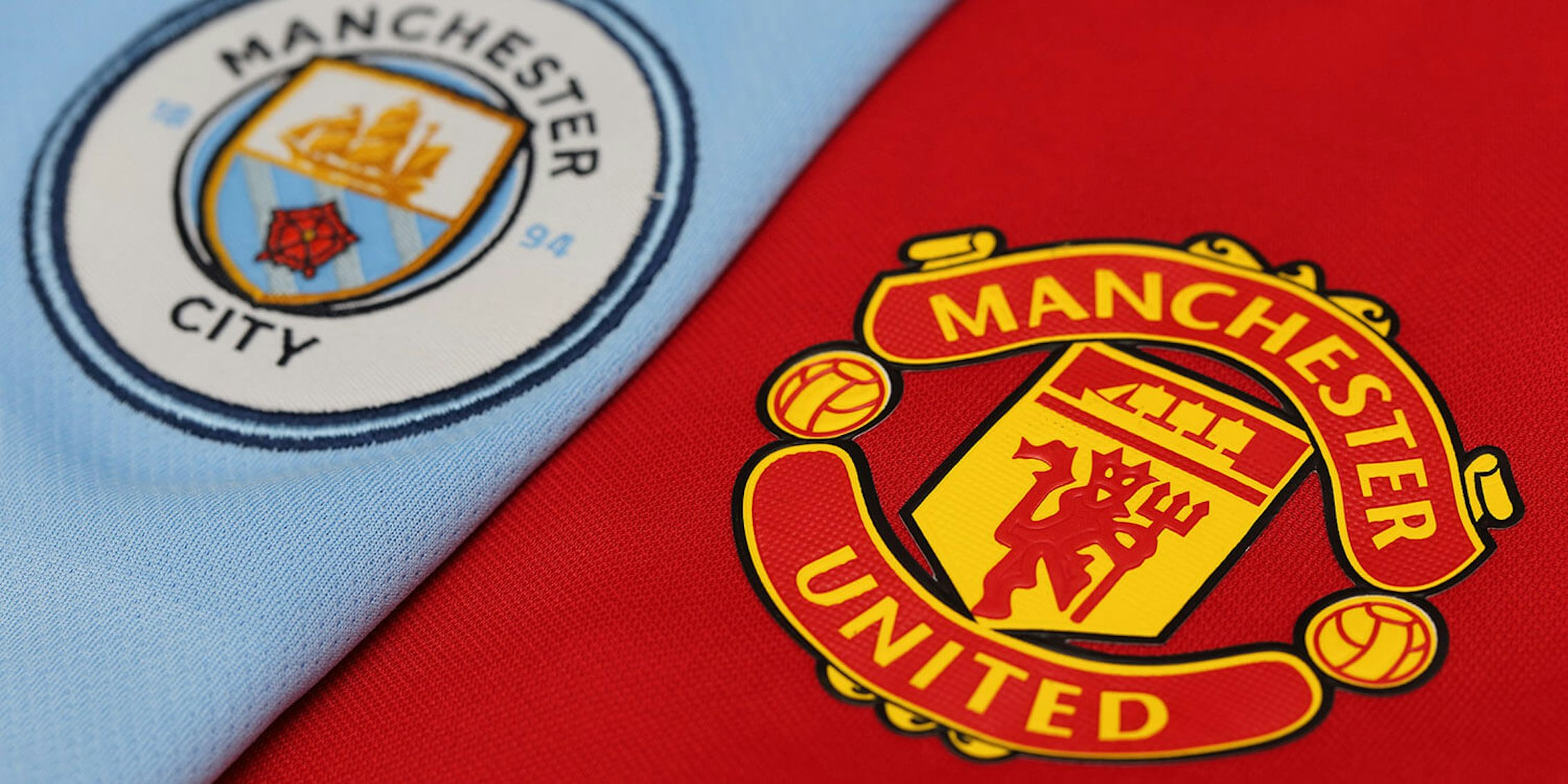 Manchester United and Manchester City logos