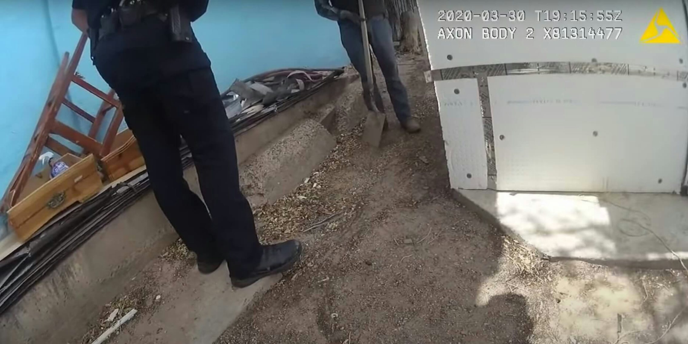 Bodycam footage shows officer Sandoval in conversation with Valente Acosta-Bustillos, who is holding a shovel