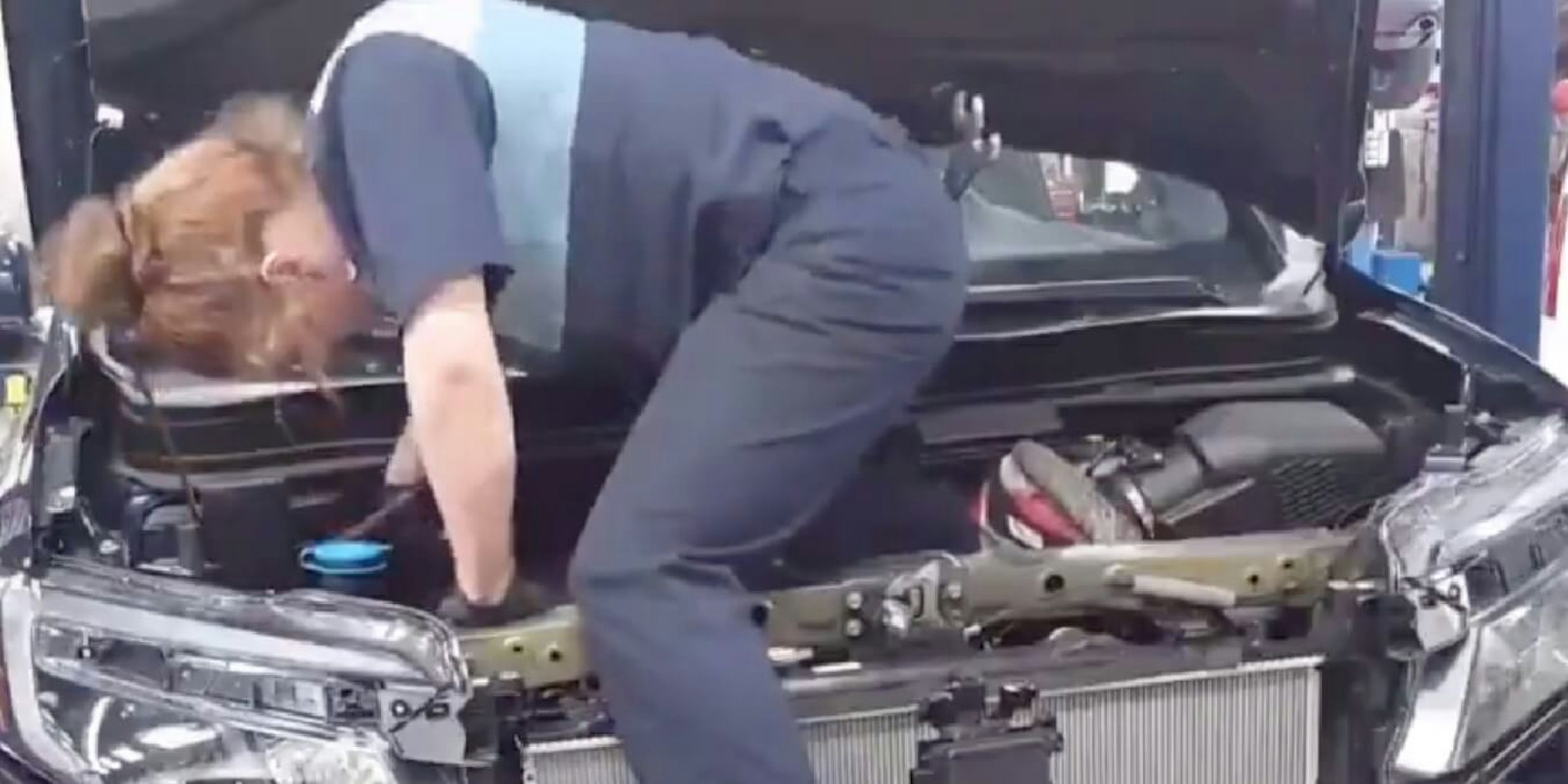 Kirsten Vaughn seen in her own video fixing a car