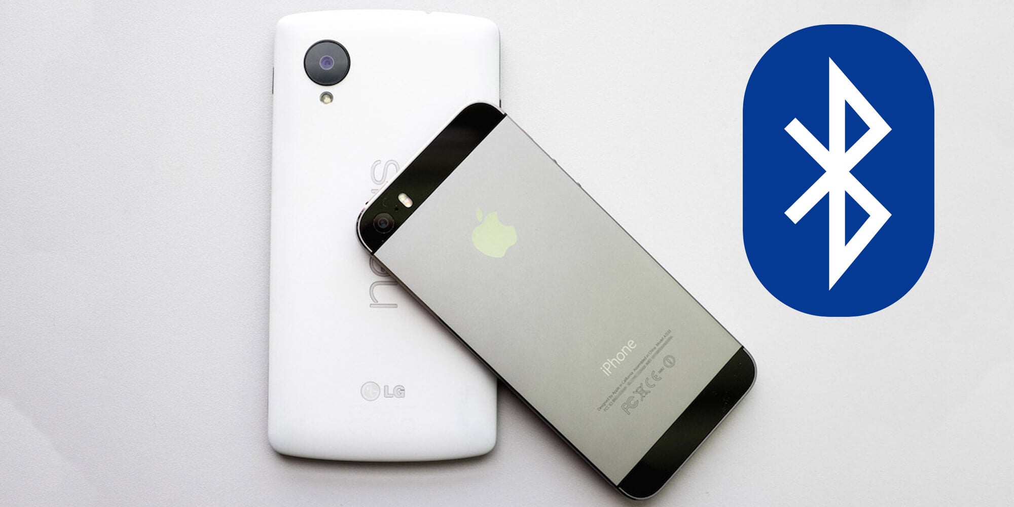 An iPhone and Android next to the bluetooth symbol