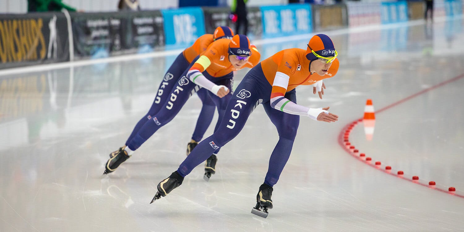Speed skaters in action