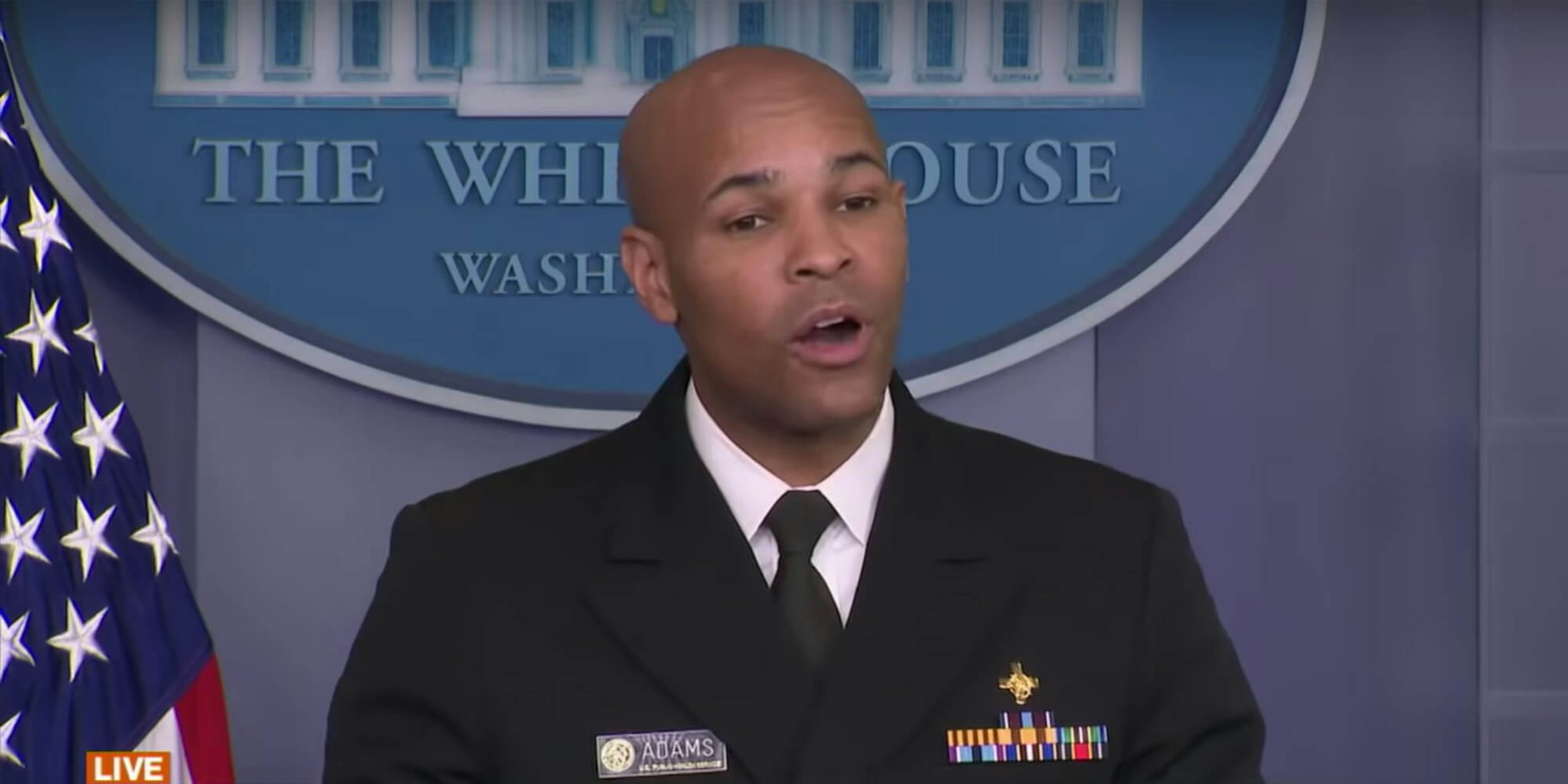 Surgeon General Jerome Adams speaking at the White House