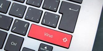 A Mac keyboard with a virus key