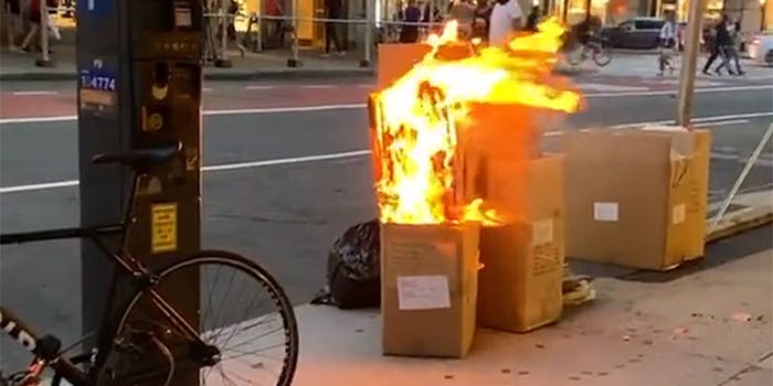 cardboard boxes on fire on NYC street