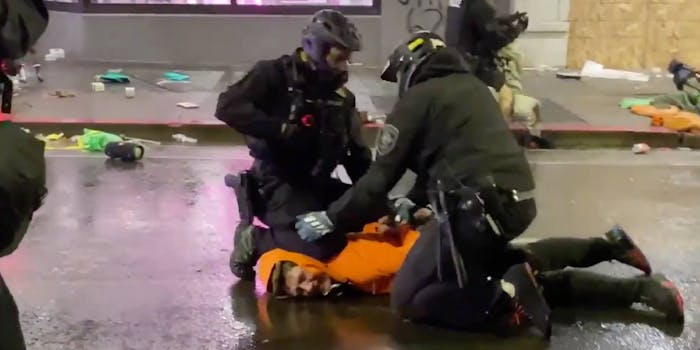 officer knee to protesters neck