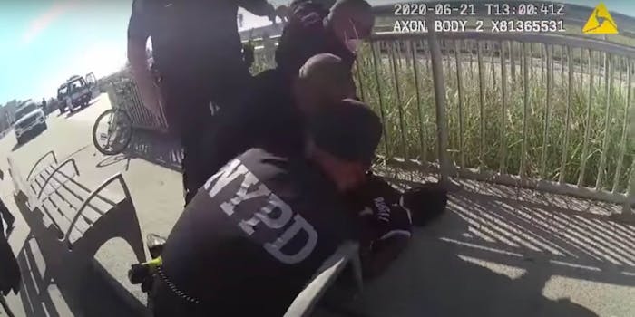 Bodycam footage shows NYPD officers huddled on a Black man