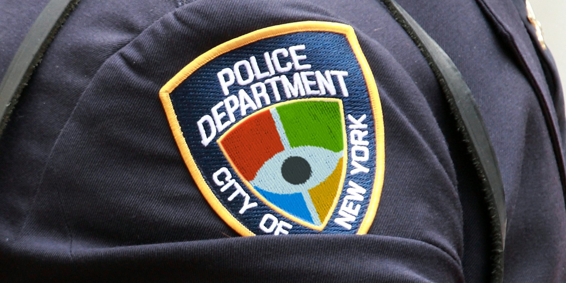 NYPD patch with Microsoft logo and open eye. Activists are calling on Microsoft to end its surveillance partnership with the NYPD.