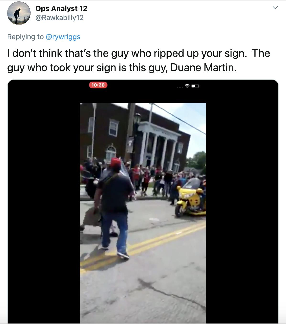 "I don’t think that’s the guy who ripped up your sign.  The guy who took your sign is this guy, Duane Martin." followed by an image of a man with a gun lunging at a protester