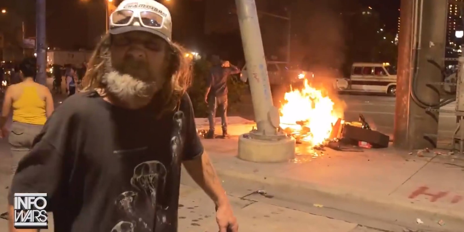 infowars austin homeless man's belonging burn during protest