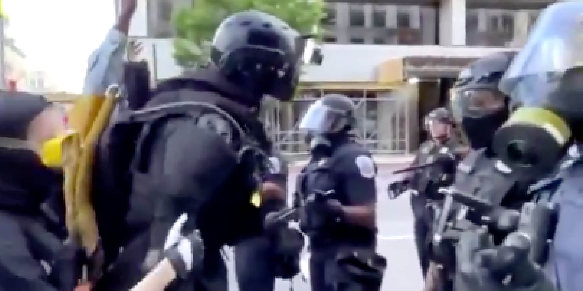 tall anonymous protester