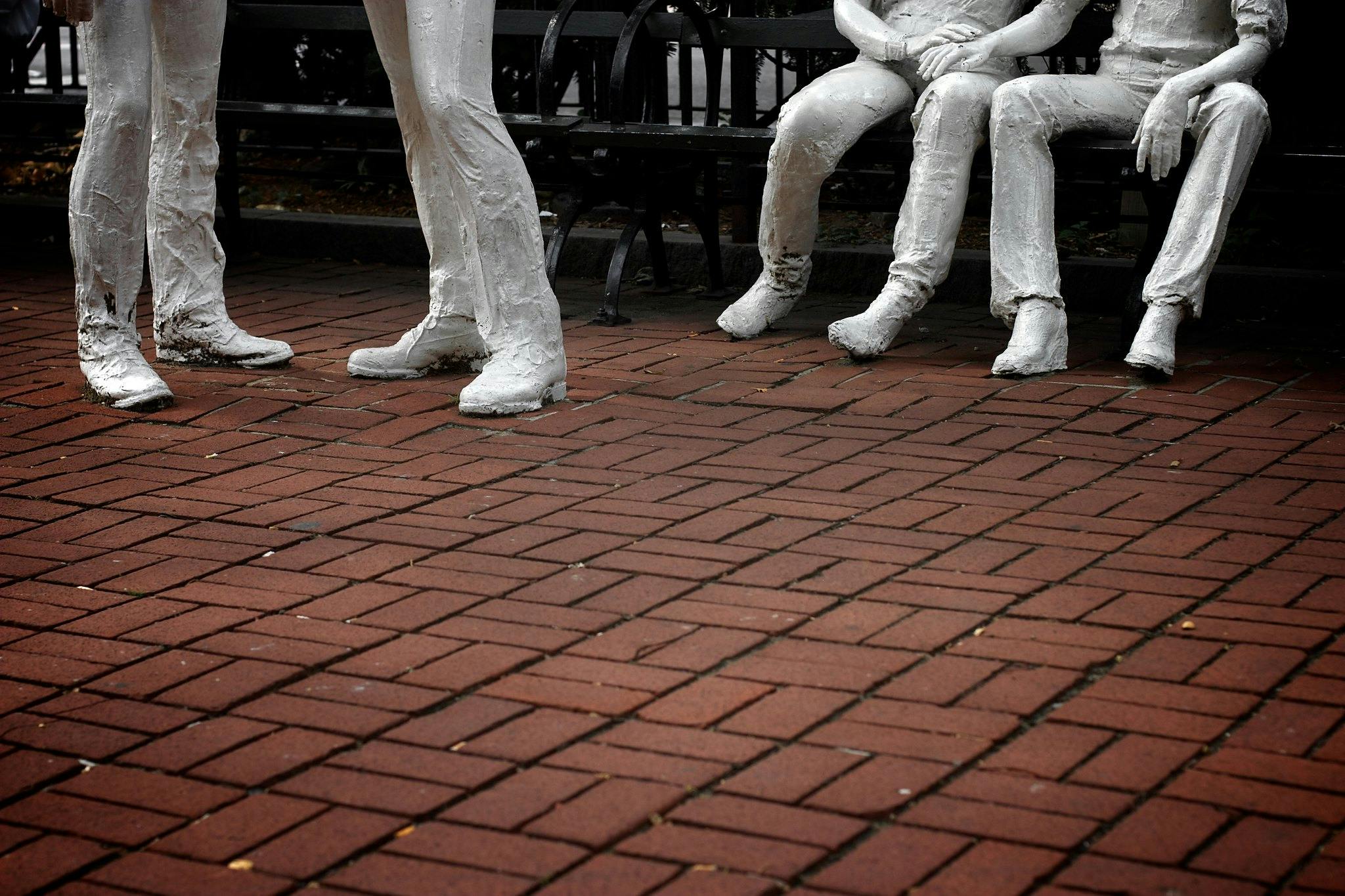 A low shot of George Segal's "Gay Liberation Monument" at the Stonewall Inn. Public sex played a key role in early queer history during the post-Stonewall era.