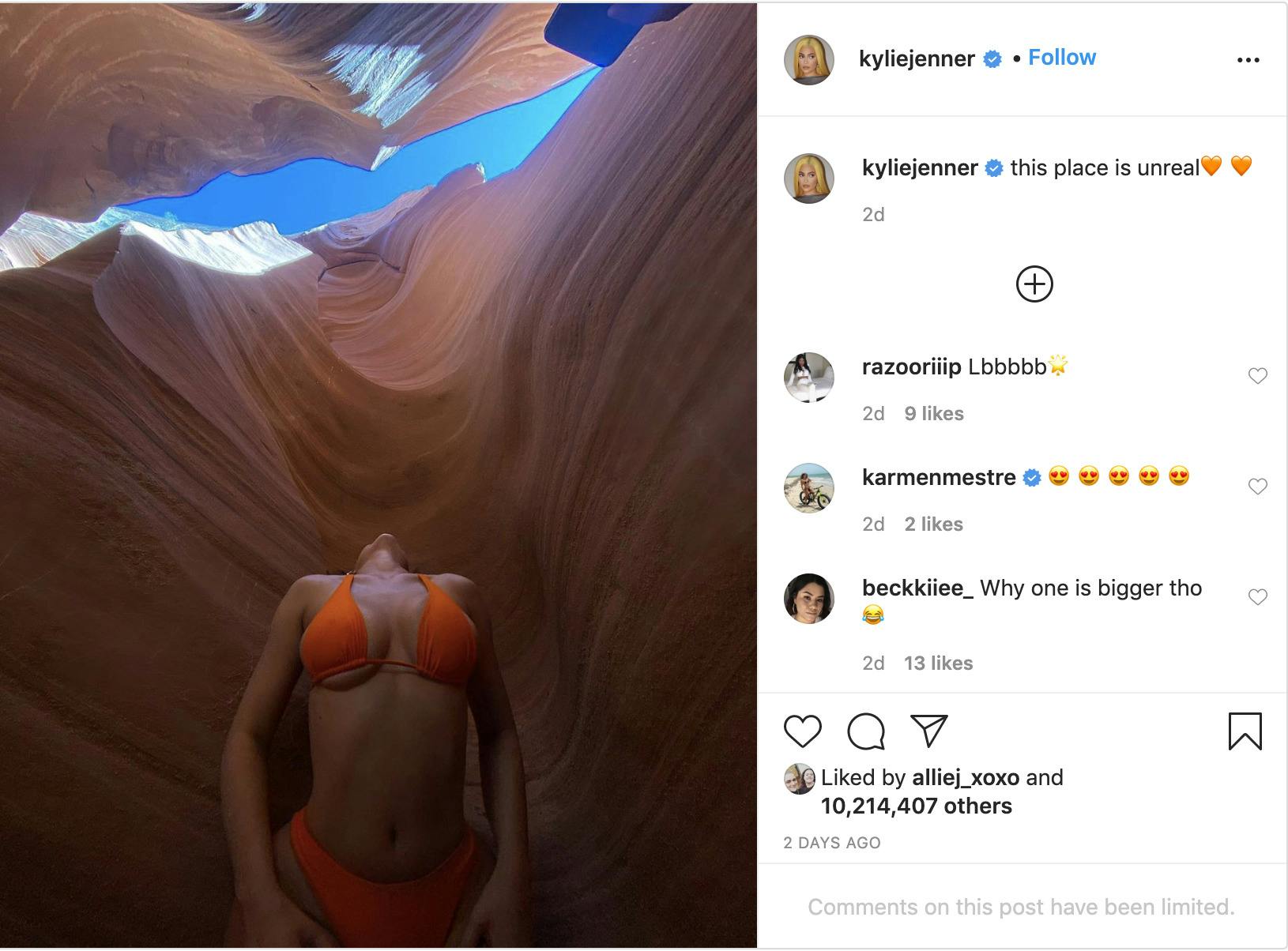 'This place is unreal' with a photo of Jenner in a bikini looking up at the opening of the canyon