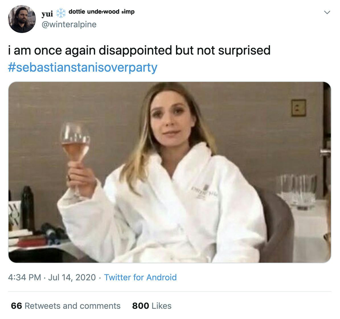 "I am once again disappointed but not surprised" gif of Elizabeth Olsen drinking wine in a bath robe