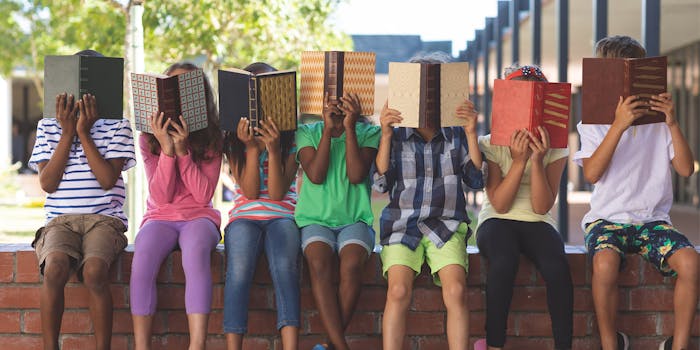 students hiding their faces behind books new york facial recognition school ban