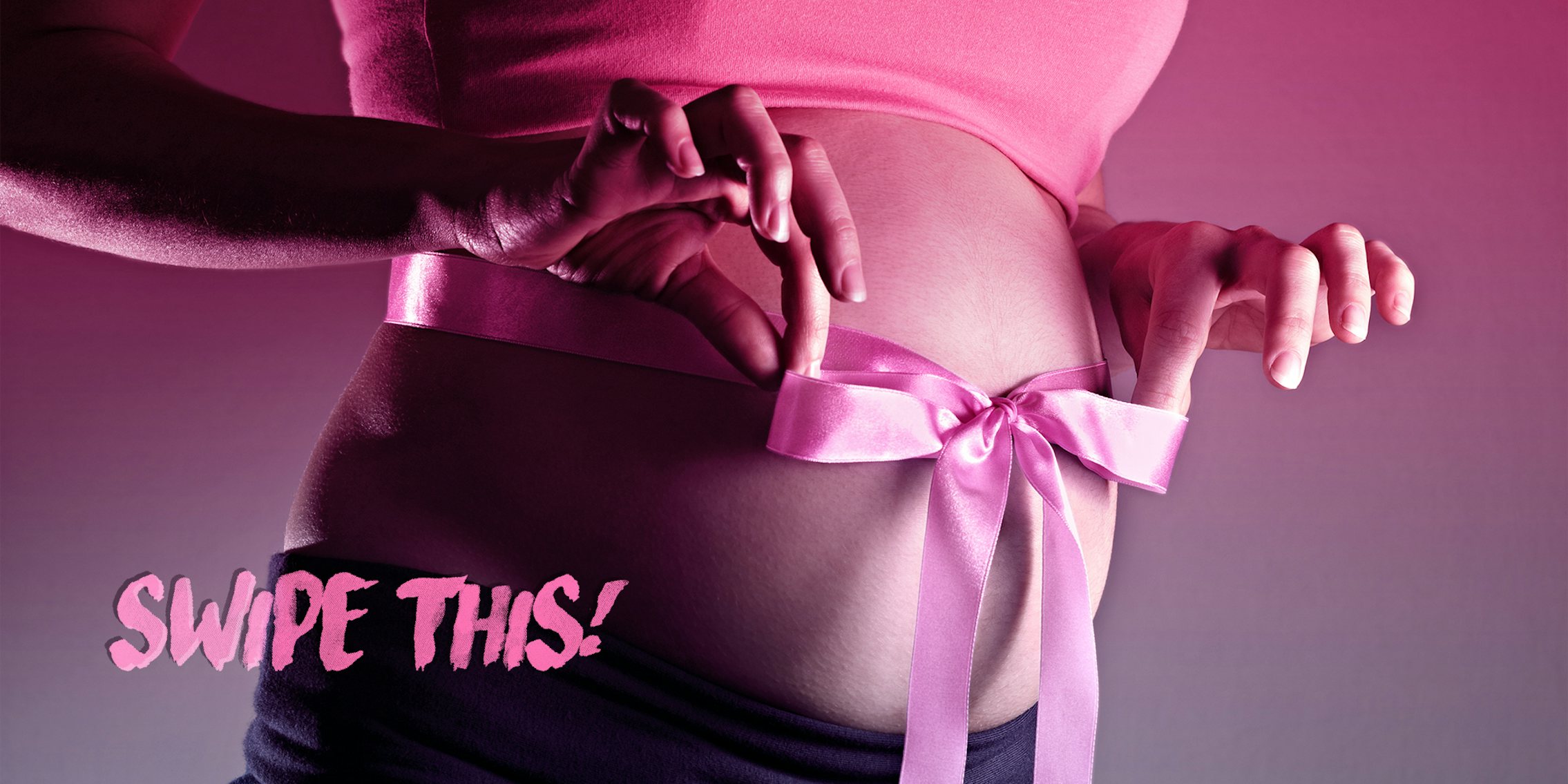 pregnant woman with ribbon tied into a bow around her belly