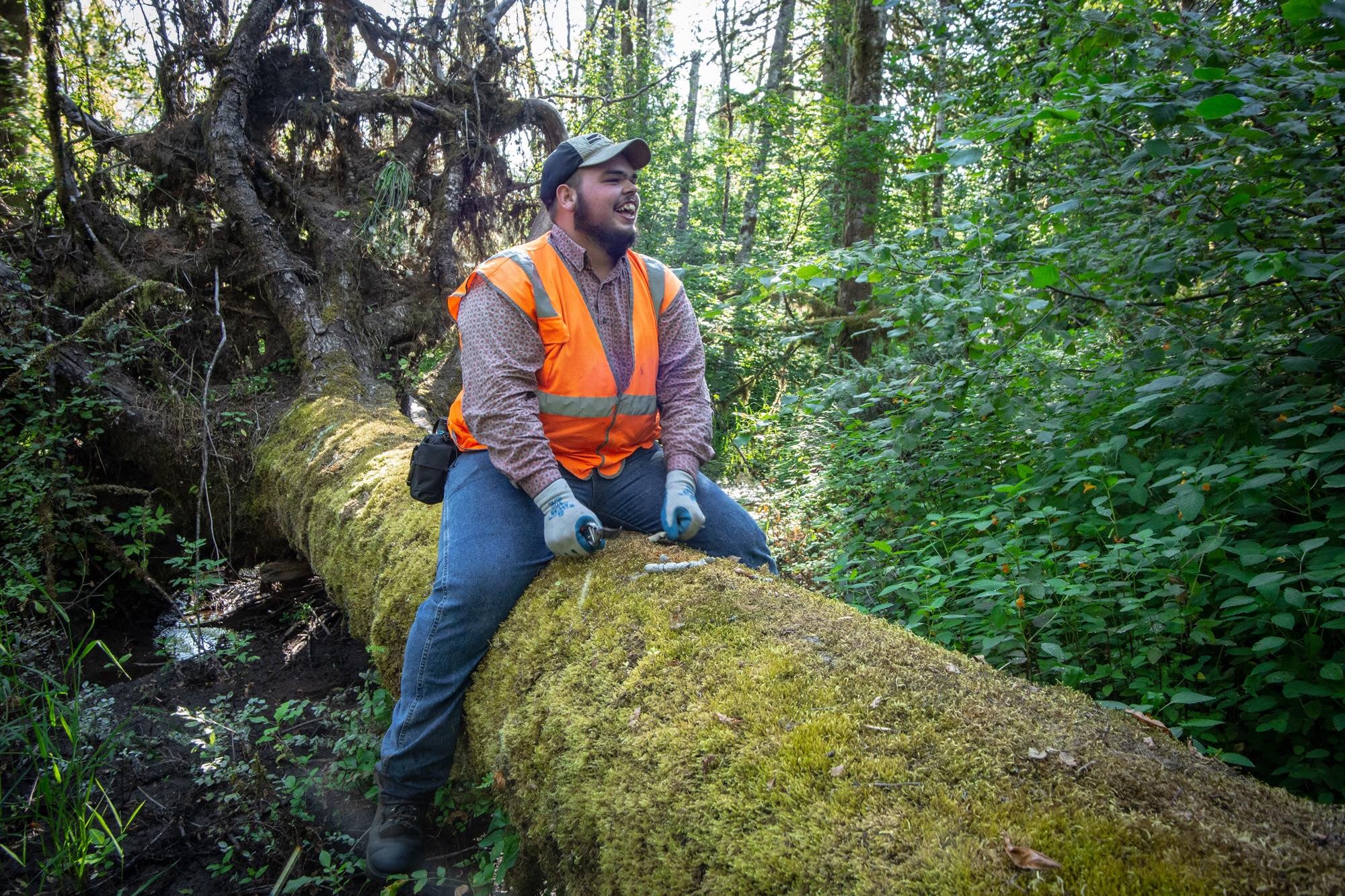 Ben Sizemore straddling the log