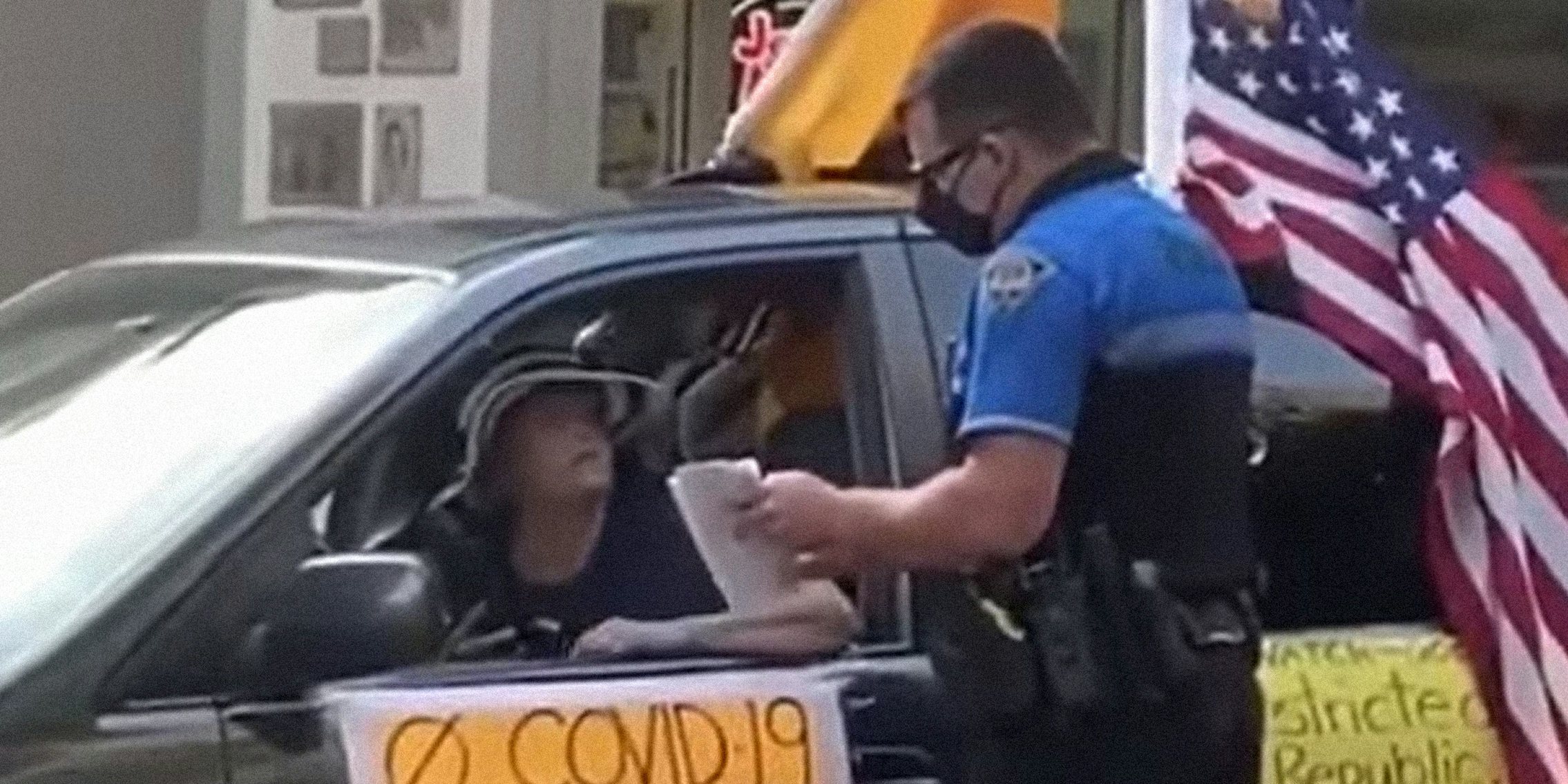 woman in car yelling at police officer