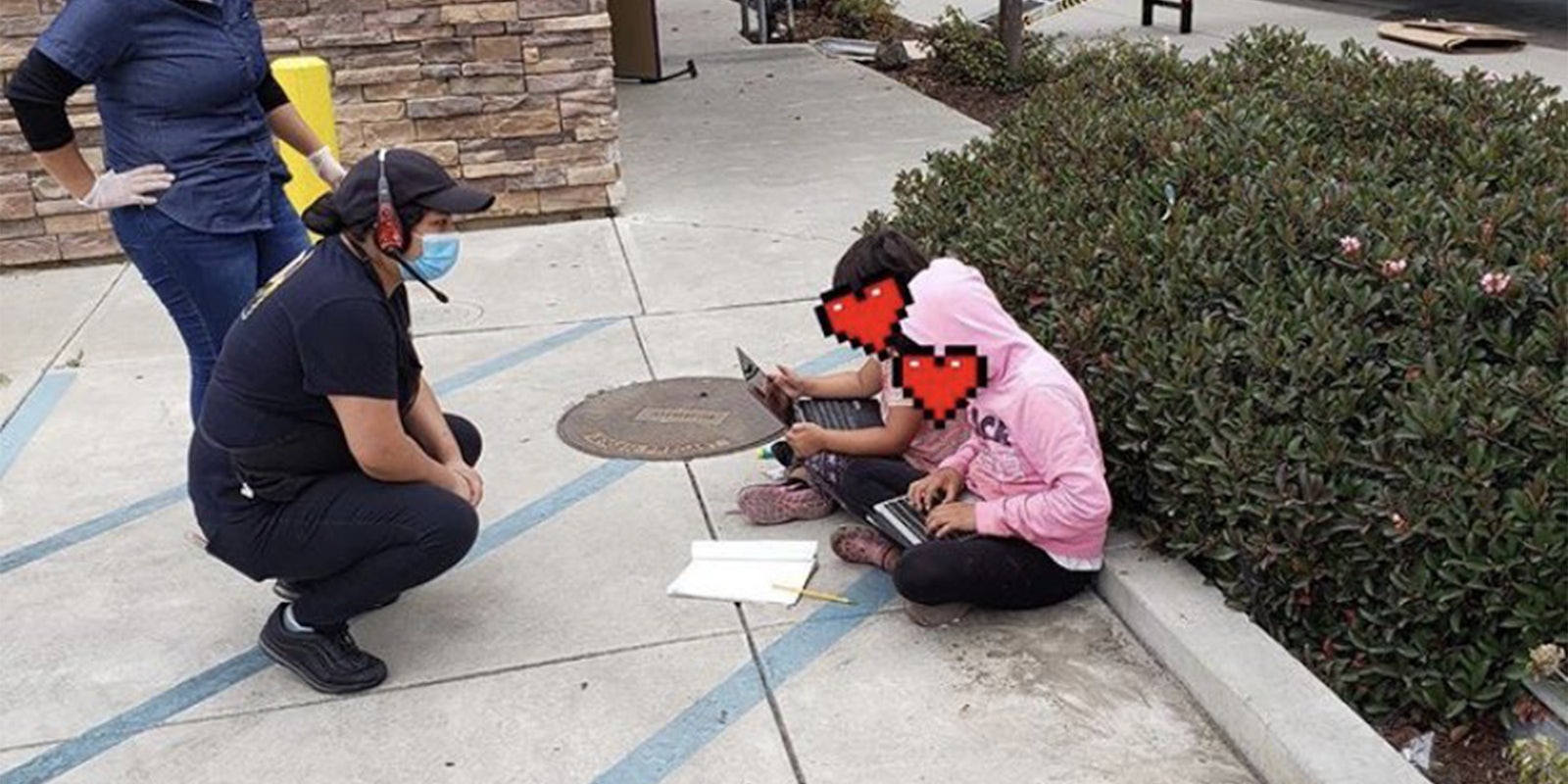 young girls sitting outside taco bell to use their wifi