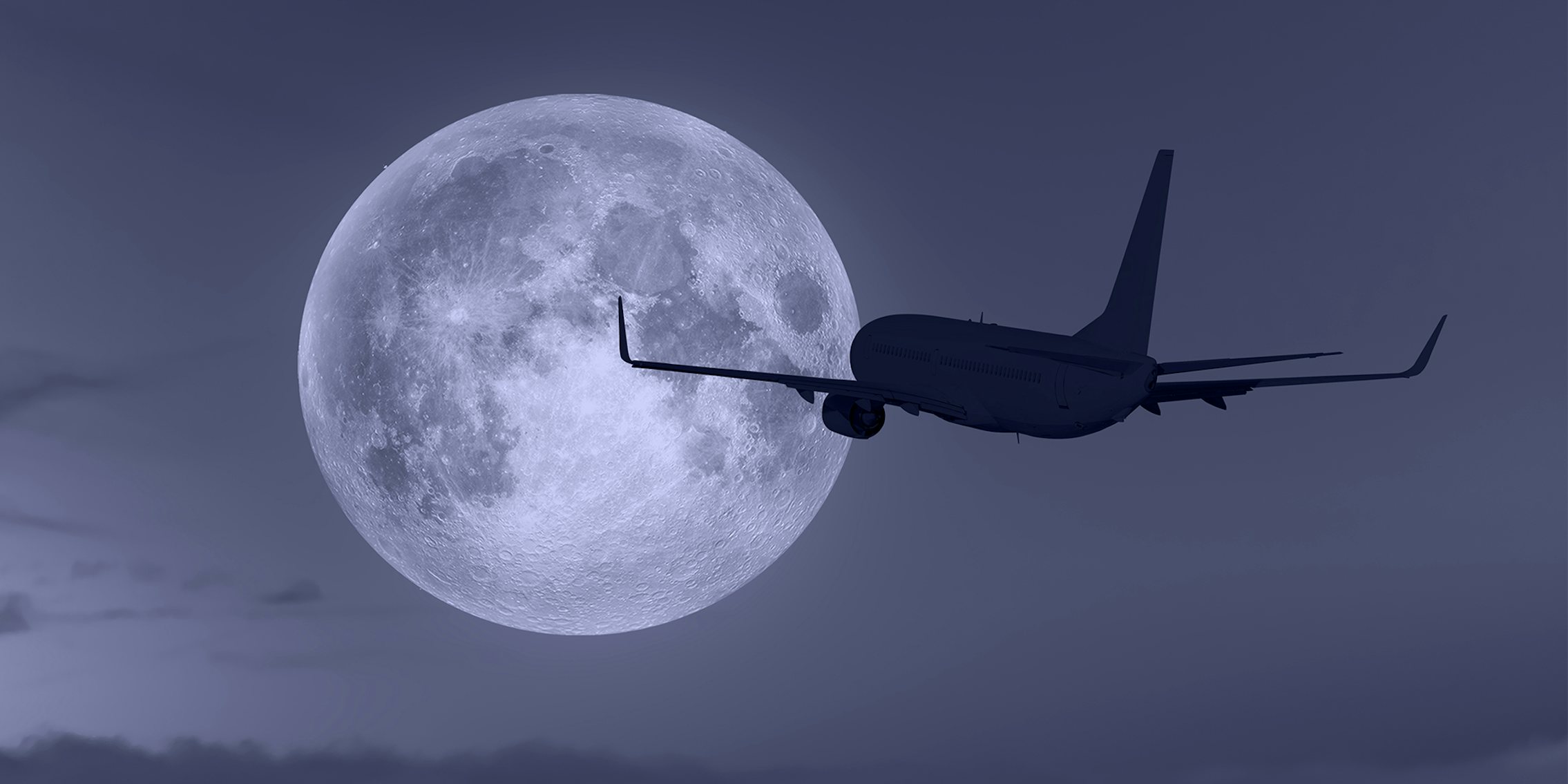 airplane with moon in background