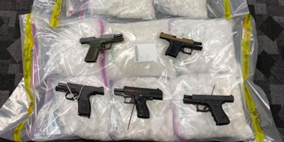 Firearms on top of bags of drugs