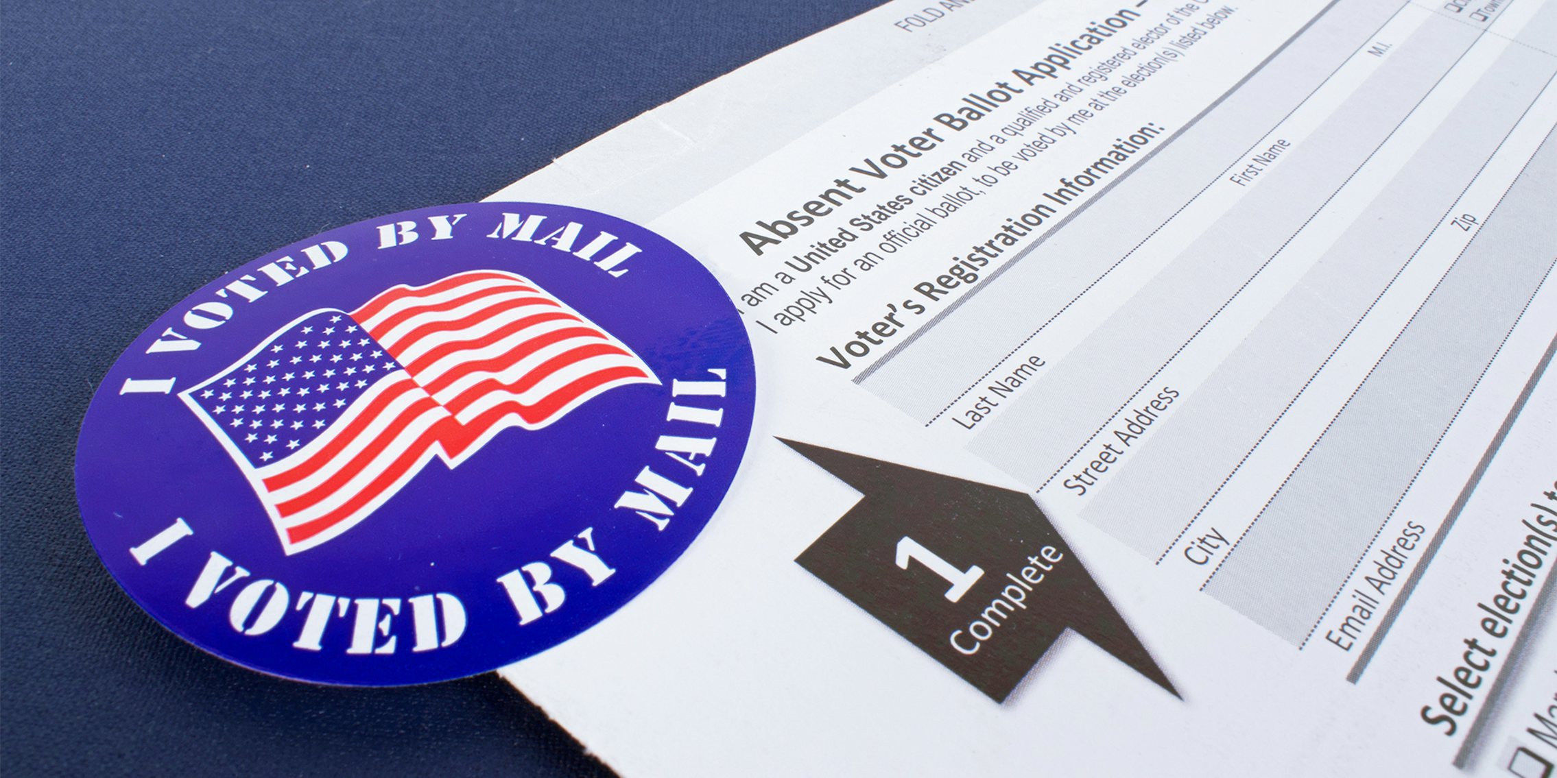 absentee ballot with 'i voted by mail' sticker