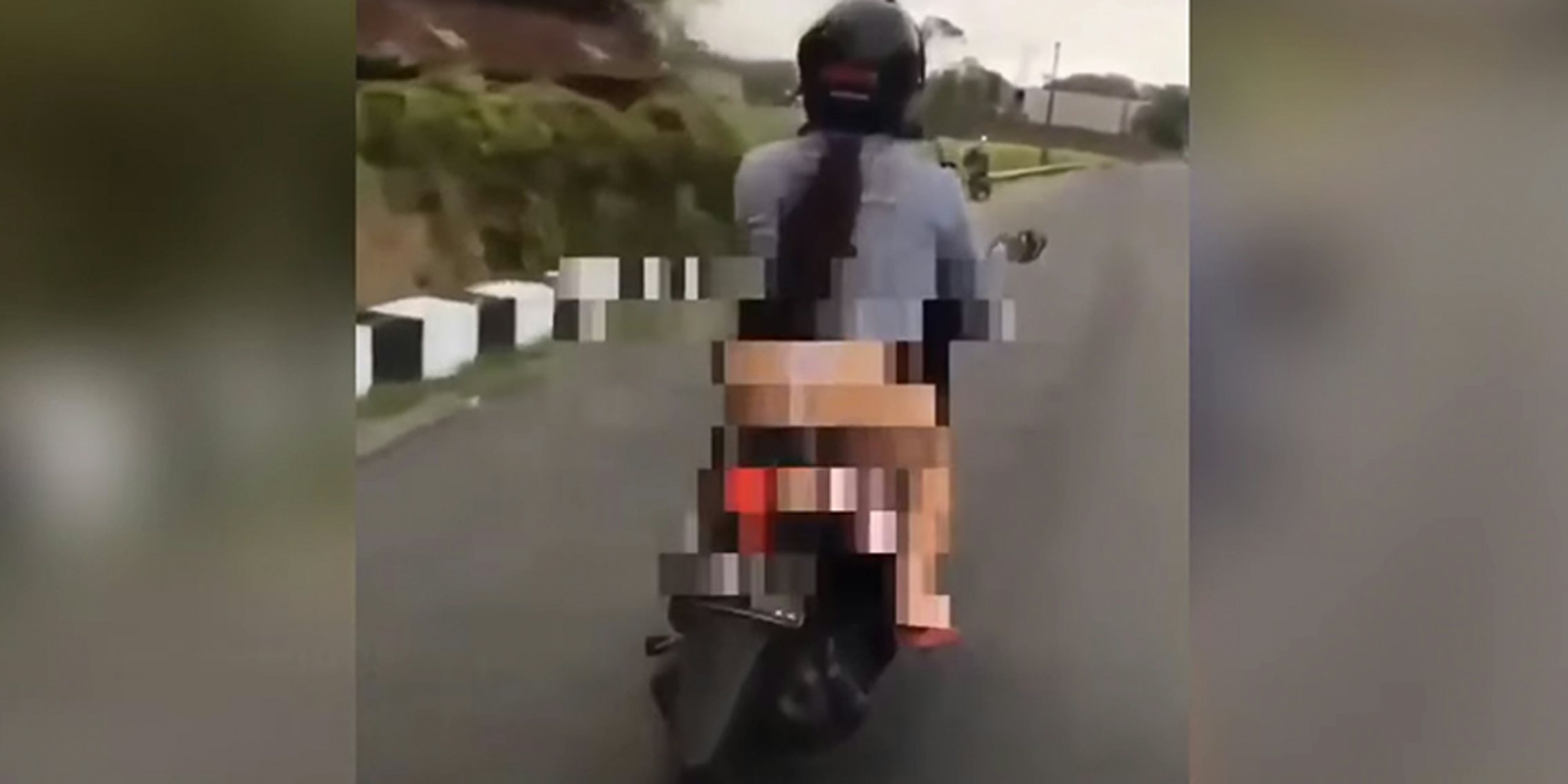 woman flashes on motorcycle