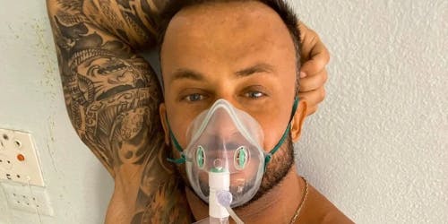 A fitness influencer wearing an oxygen mask