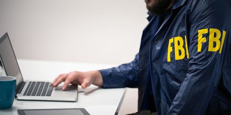 fake fbi agent on laptop