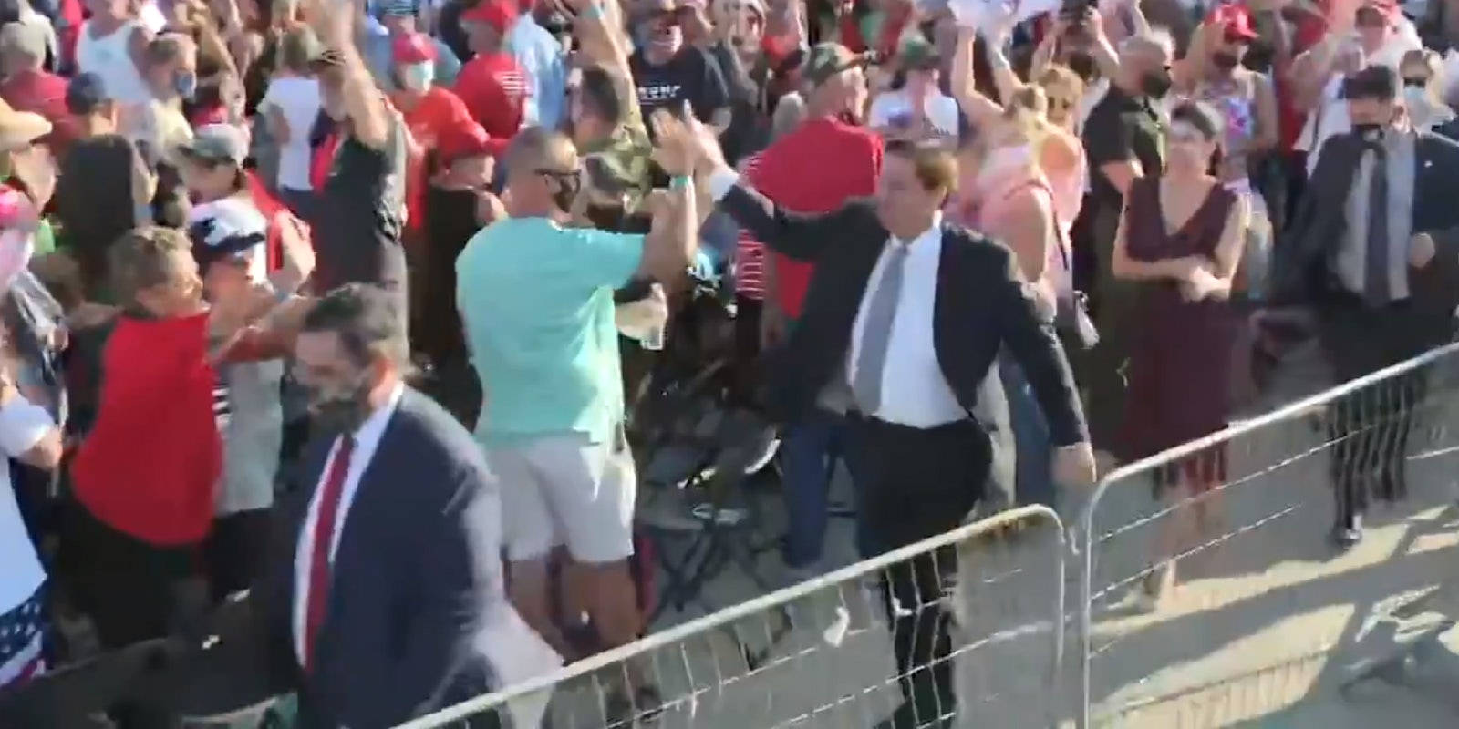 Ron DeSantis high fives people in crowd