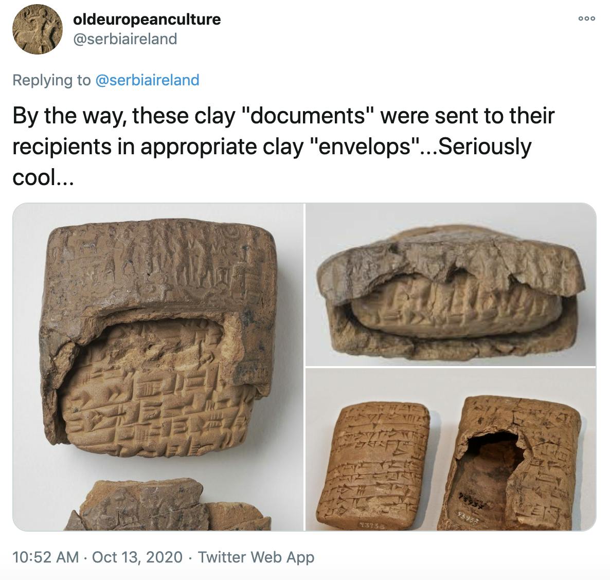 'By the way, these clay 'documents' were sent to their recipients in appropriate clay 'envelops'...Seriously cool...' picture of the tablets with their clay wrappers half cracked off to show the tablet inside