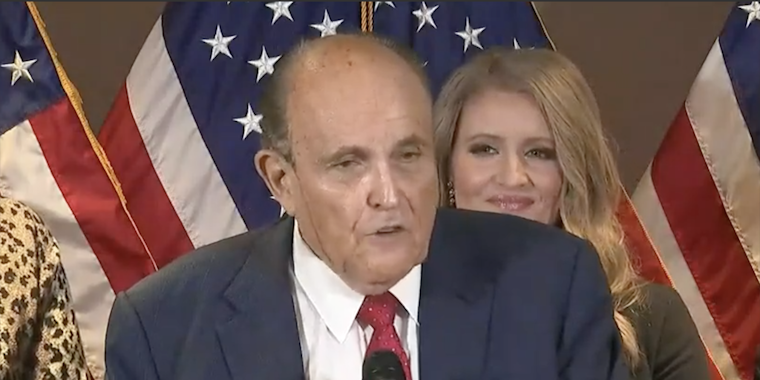 Hair dye appears to drip down Guiliani's face at presser