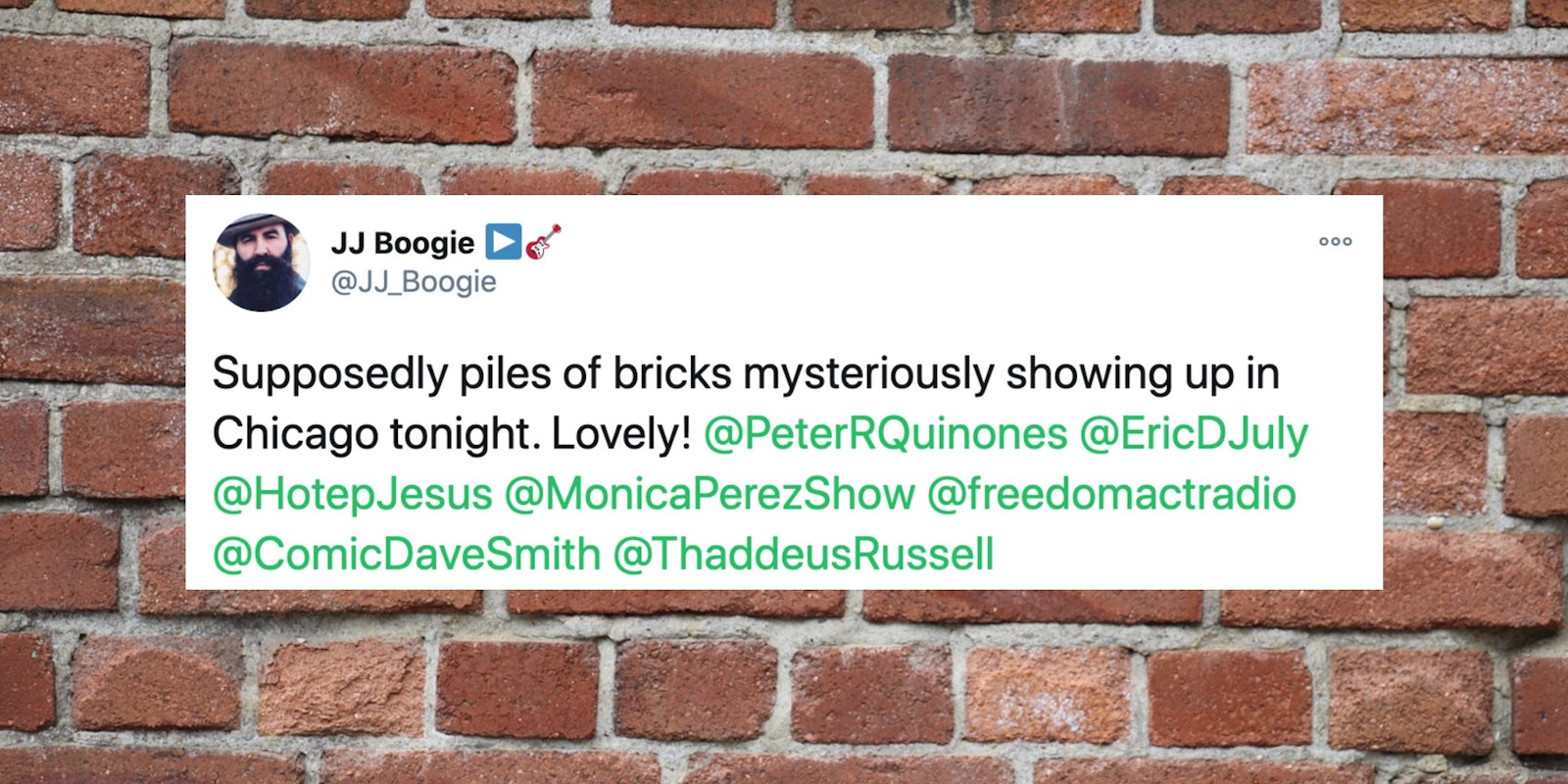 a tweet over a brick wall