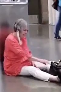 maskless woman sits on floor in costco