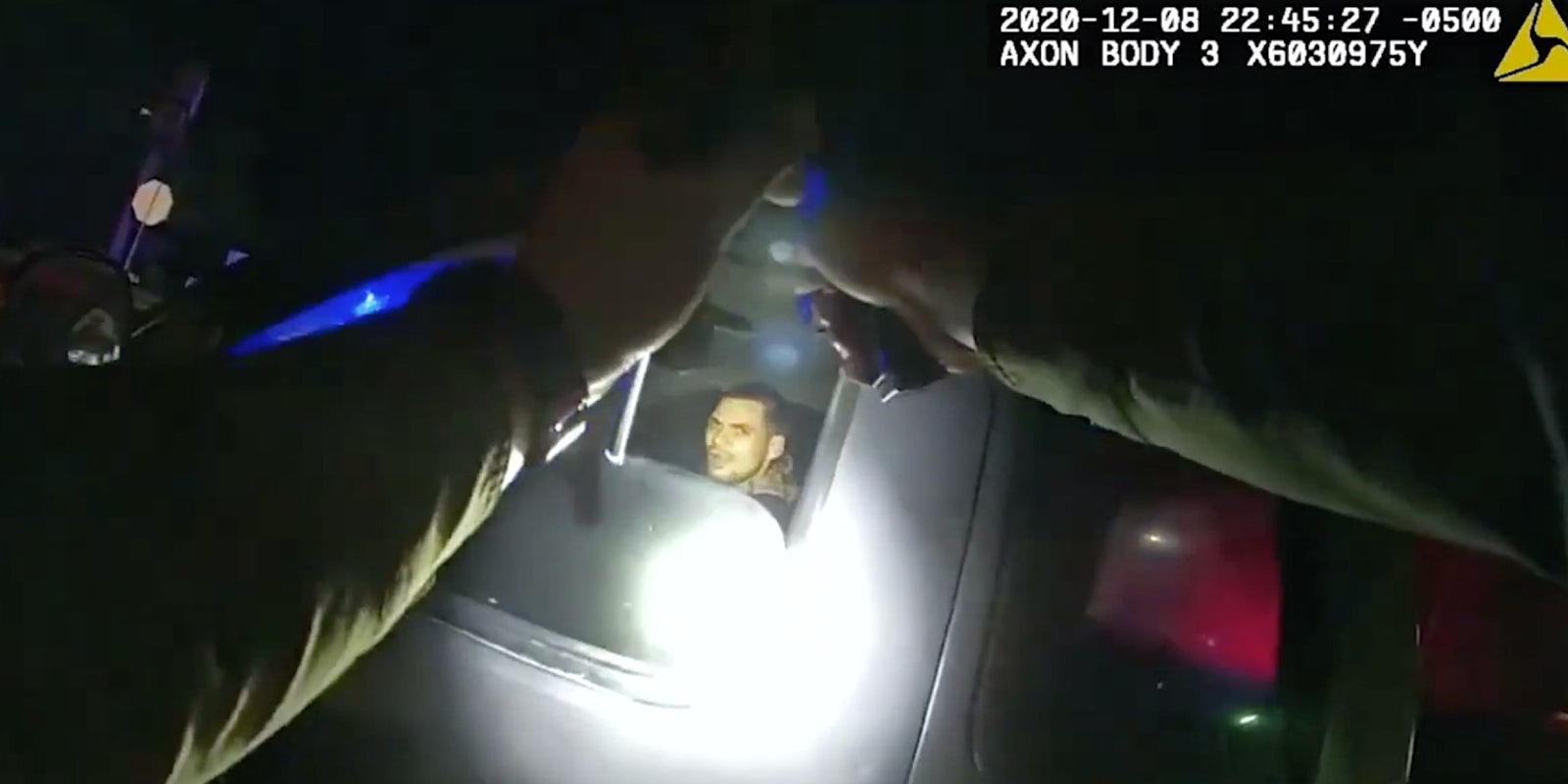 Dylan Scott inside a car while a Hillsborough County deputy pleads with him to comply