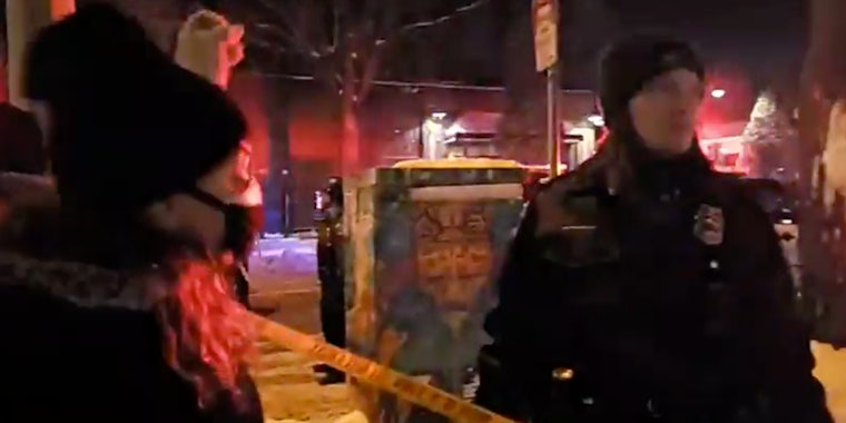 cop spits at Minneapolis protester