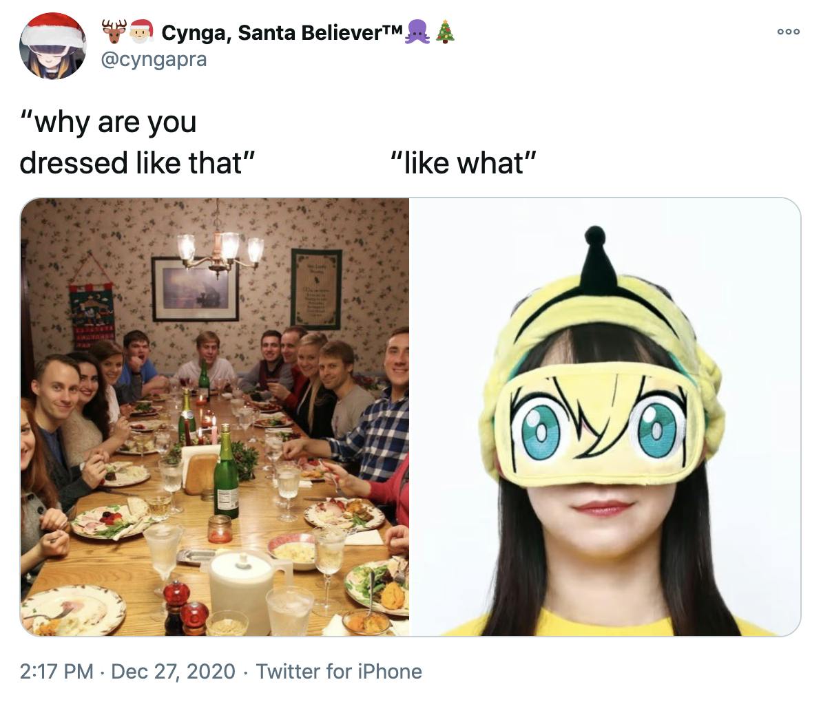 'why are you dressed like that? like what?' a photograph of a white family around a Christmas dinner table all looking at the camera with surprised expressions and a dark haired pale skinned woman in a yellow anime eye mask with an odd black bowling skittle like device on top of her head