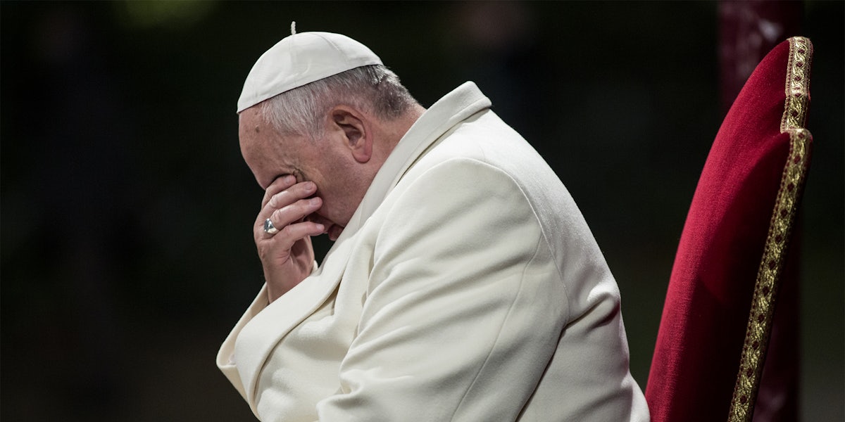 pope francis covering his eyes with his hand