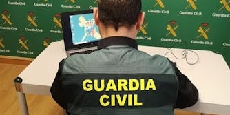 guardia civil officer on computer