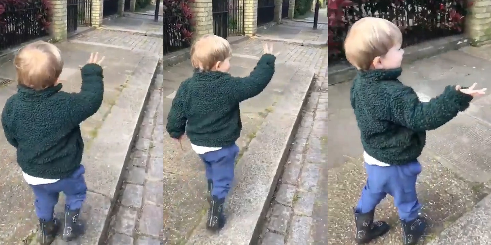 young boy waves hi to pretend strangers on walk