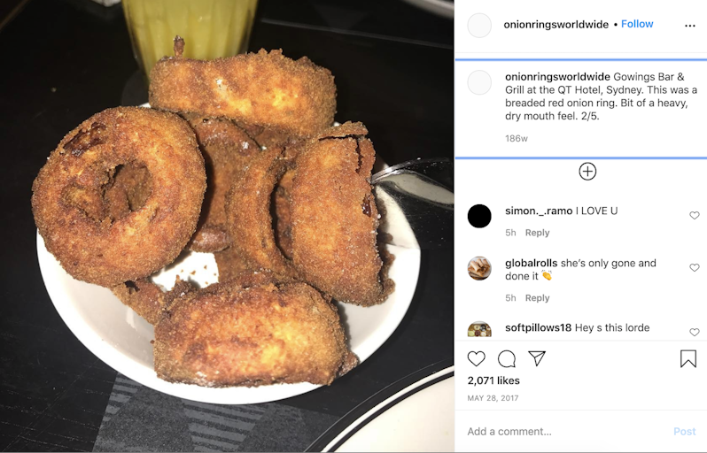 A photograph of thick reddish-brown breaded onion rings with the caption "Gowings Bar & Grill at the QT Hotel, Sydney. This was a breaded red onion ring. Bit of a heavy, dry mouth feel. 2/5. 186w"
