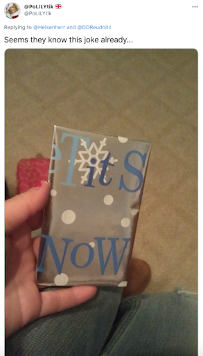"Seems they know this joke already..." a present wrapped in let it snow paper, arranged so tits now is on the front