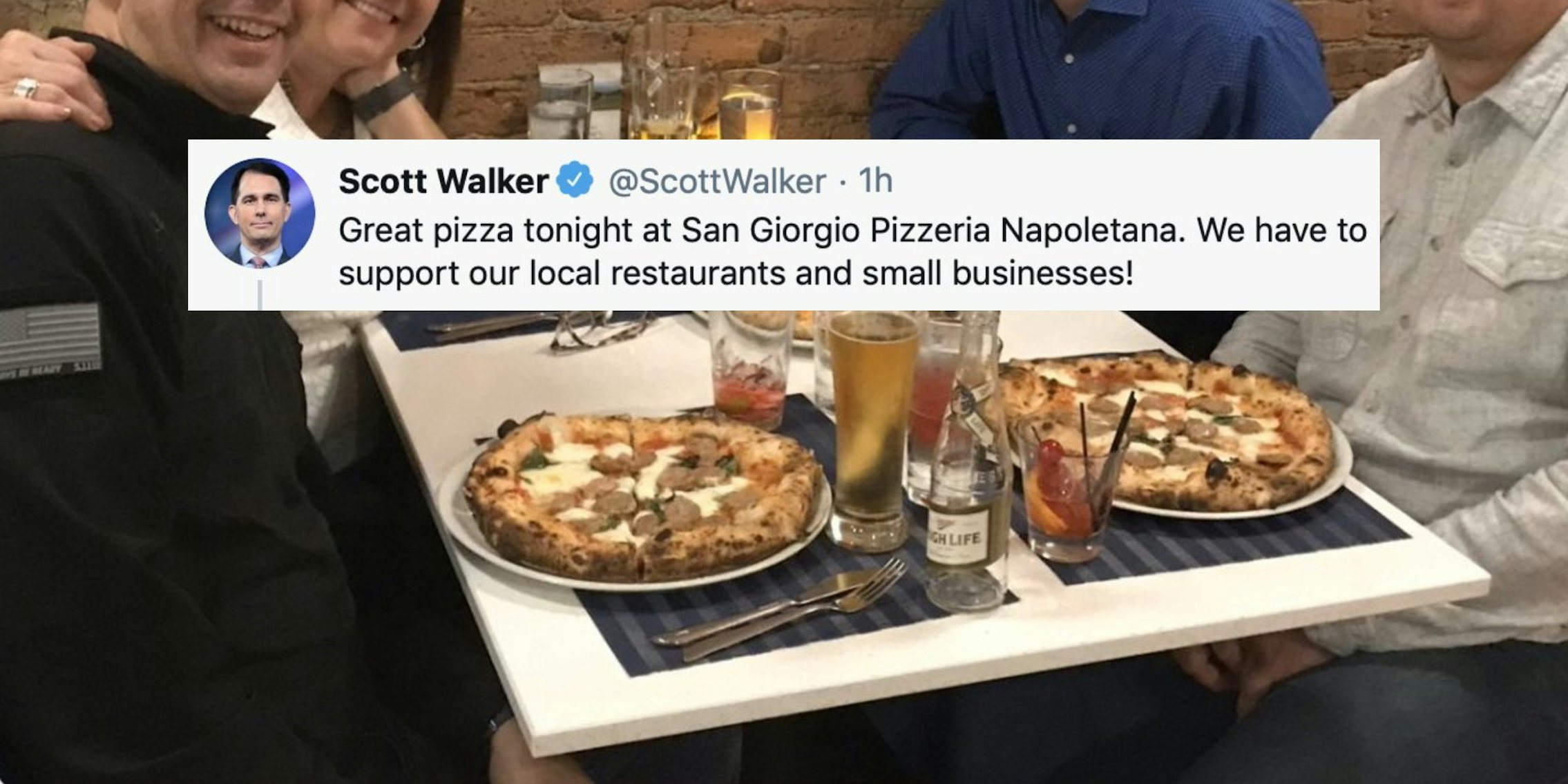 A tweet over a picture of a Pizza dinner