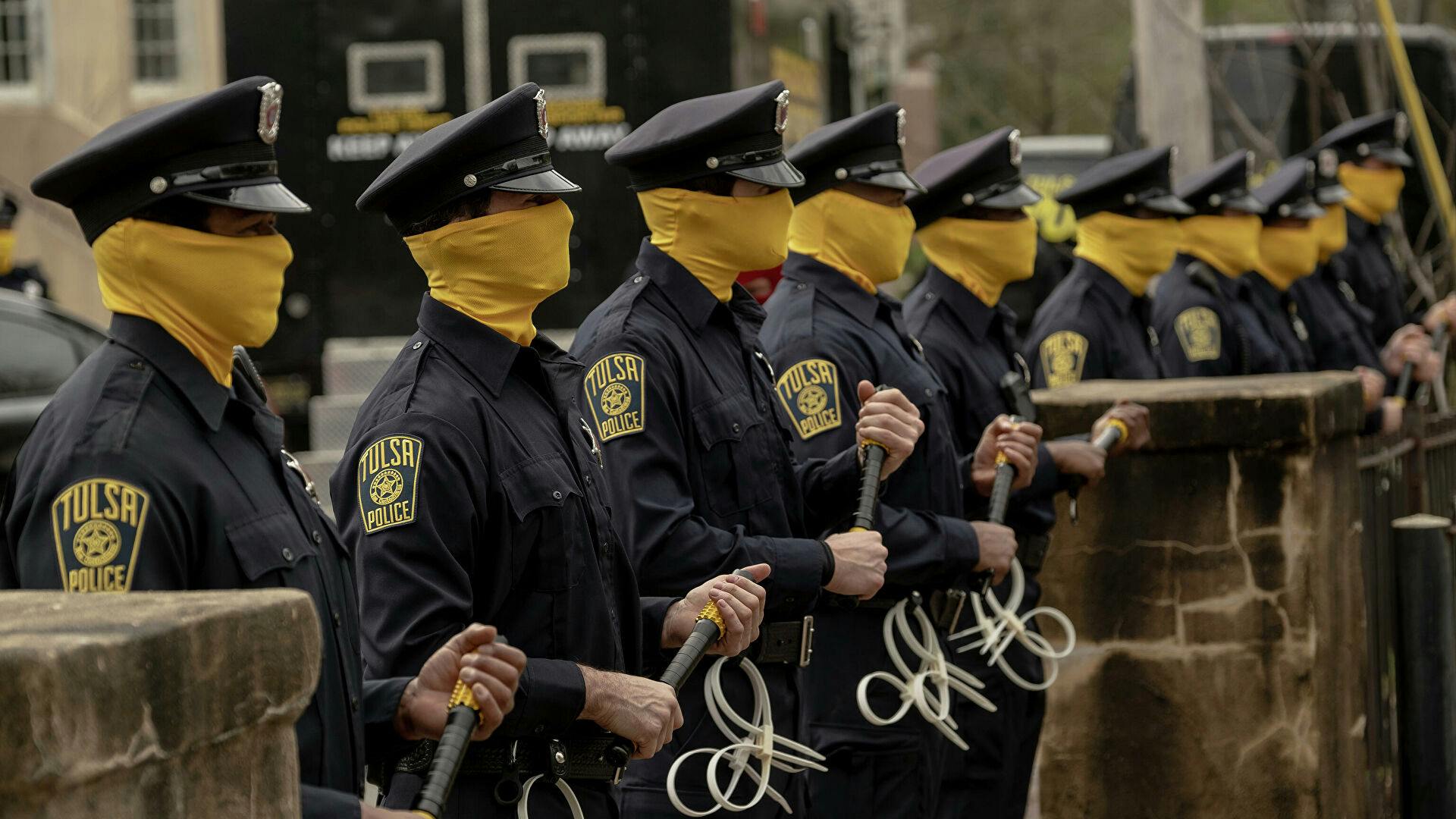 watchmen police officers in yellow masks