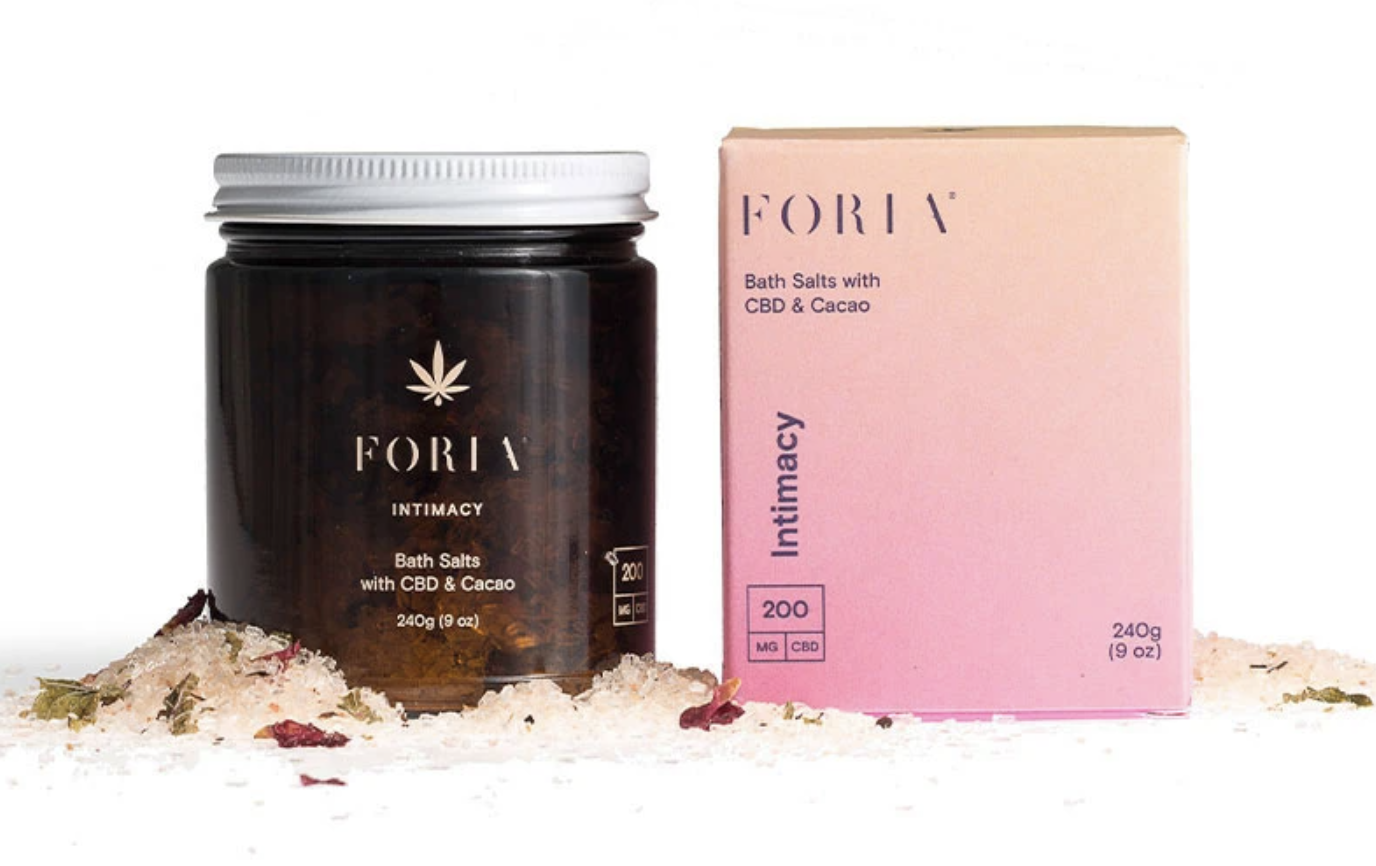 Foria CBD bath salts scattered around its packaging show how luxurious Foria products are.