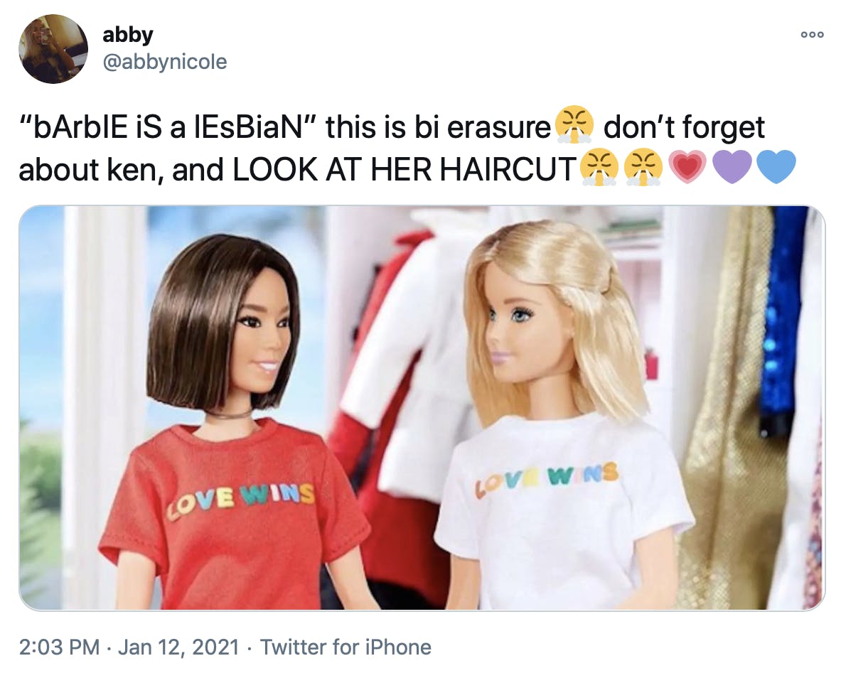 '“bArbIE iS a lEsBiaN” this is bi erasureFace with look of triumph don’t forget about ken, and LOOK AT HER HAIRCUTFace with look of triumphFace with look of triumphGrowing heartPurple heartBlue heart' screenshot of the two dolls sat next to each other in the love wins t shirts with Barbie on the right