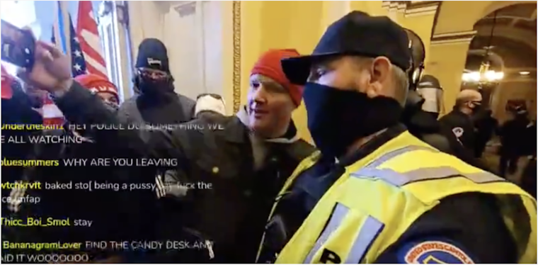 Cop poses for a selfie with Trump supporters on capitol hill during riots