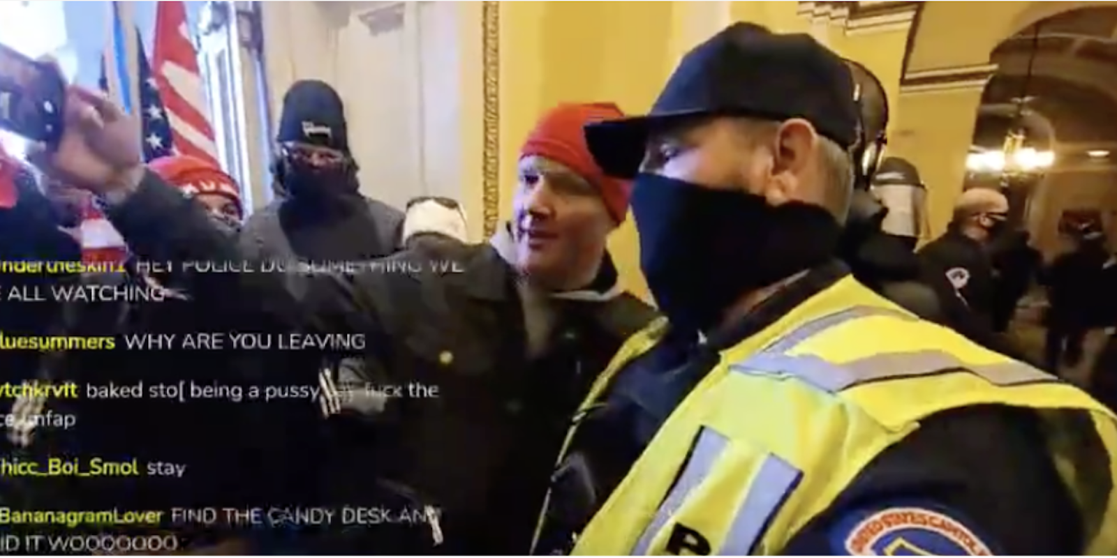 Cop poses for a selfie with Trump supporters on capitol hill during riots