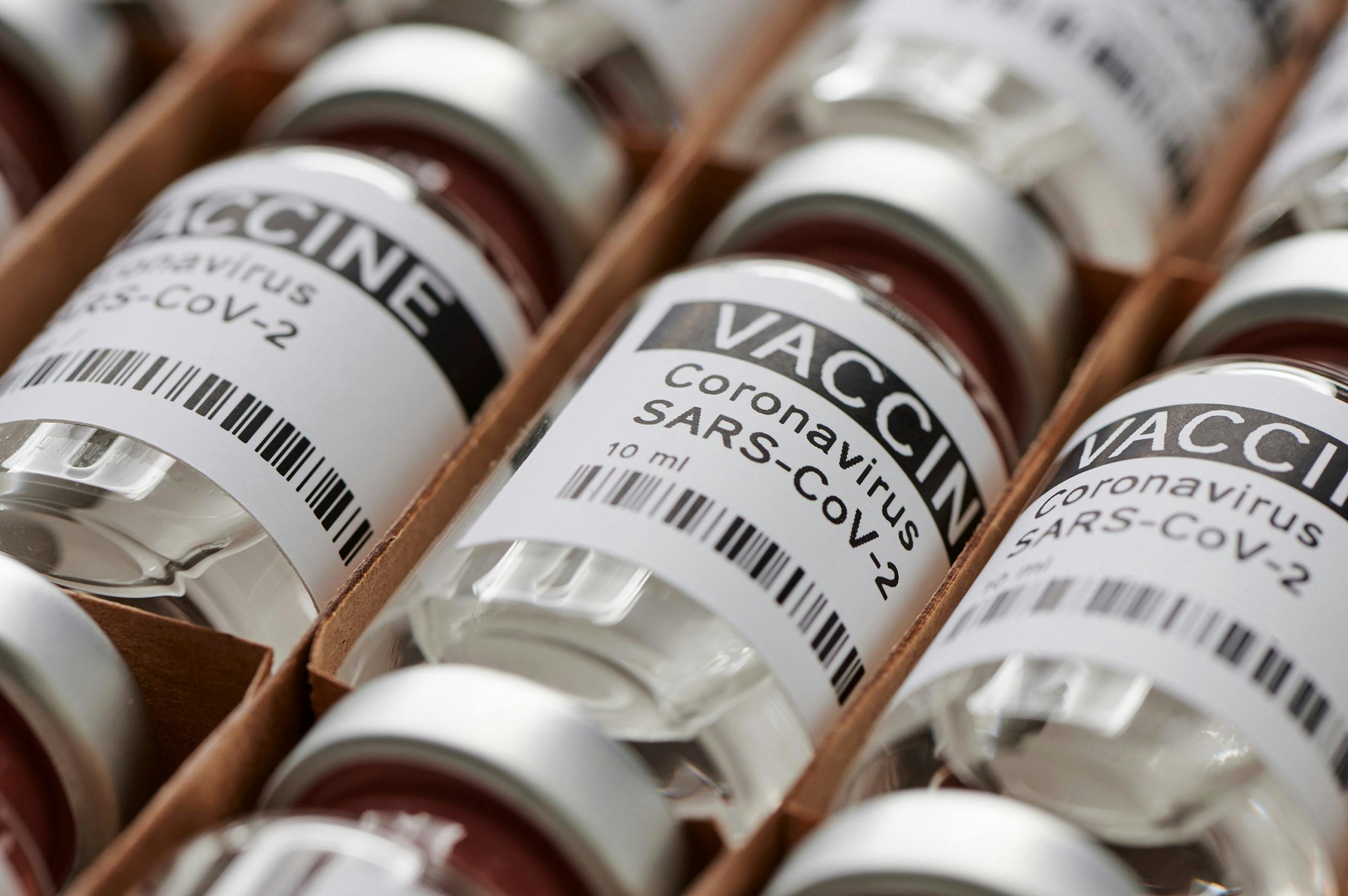 Close up image of vials of the coronavirus vaccine neatly organized in a box.