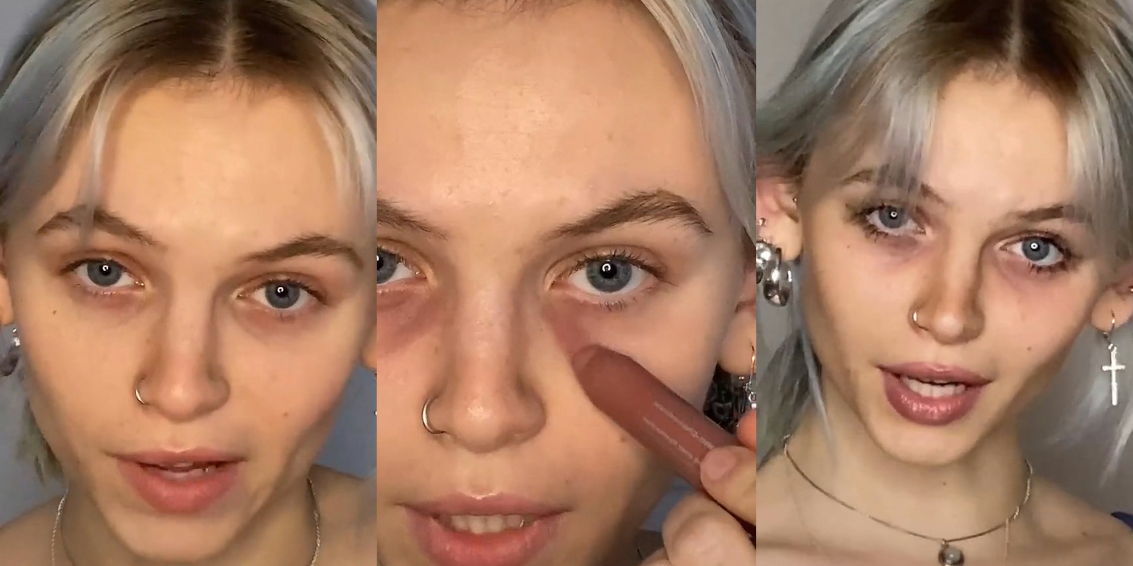 young woman puts dark makeup around her eyes